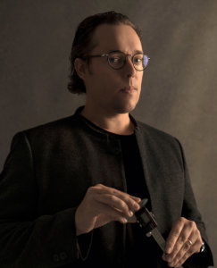Kenneth Weigelt holding a micrometer