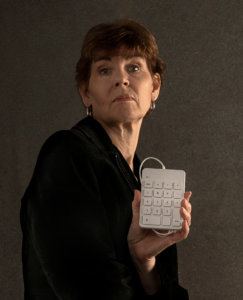 Donna Blocher holding calculator number pad