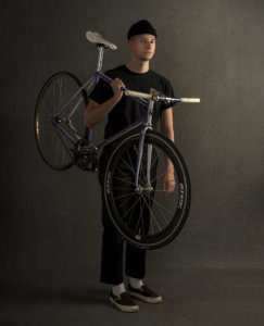 Gavin Rear holding fixed gear bicycle