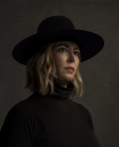 Whitney wearing a black hat