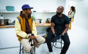 Bima and Plant-based Papi chef talking in kitchen
