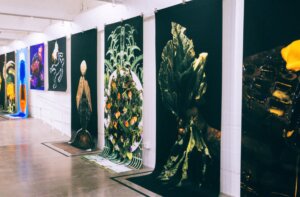 close up of prints hanging from gallery wall