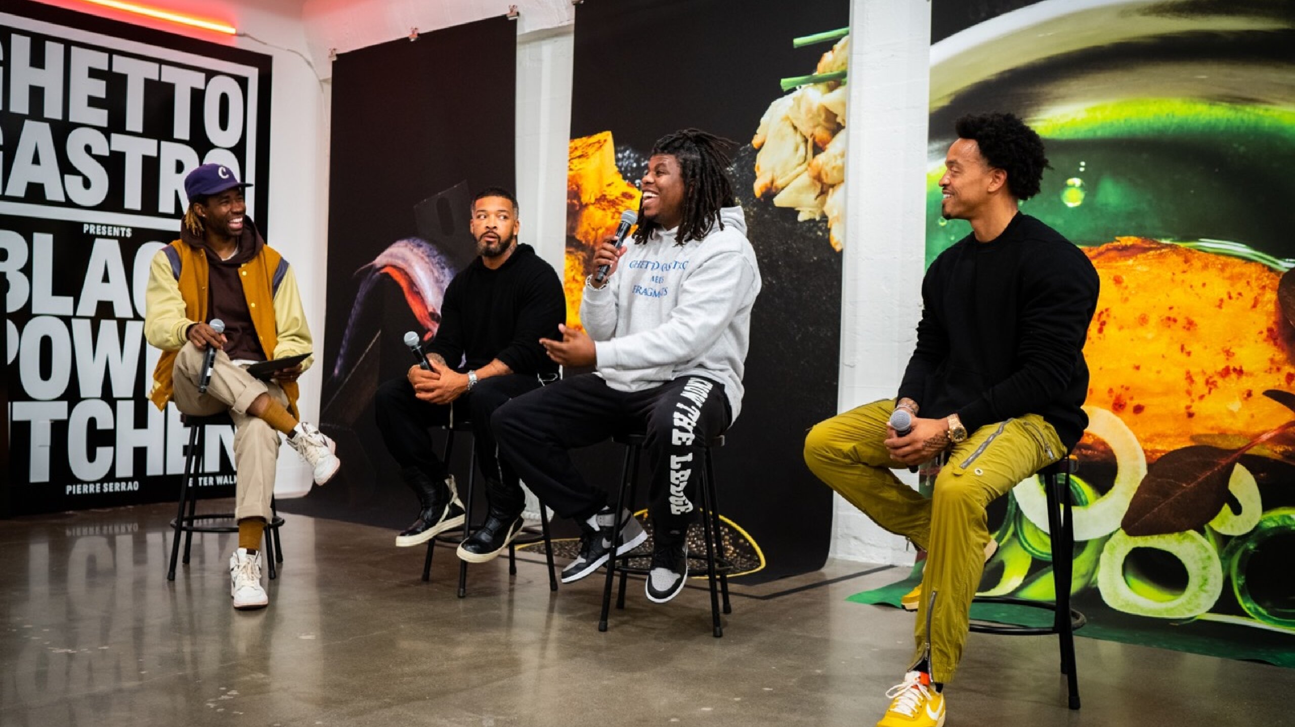 Ghetto Gastro Authors sitting on stools with mics talking about book