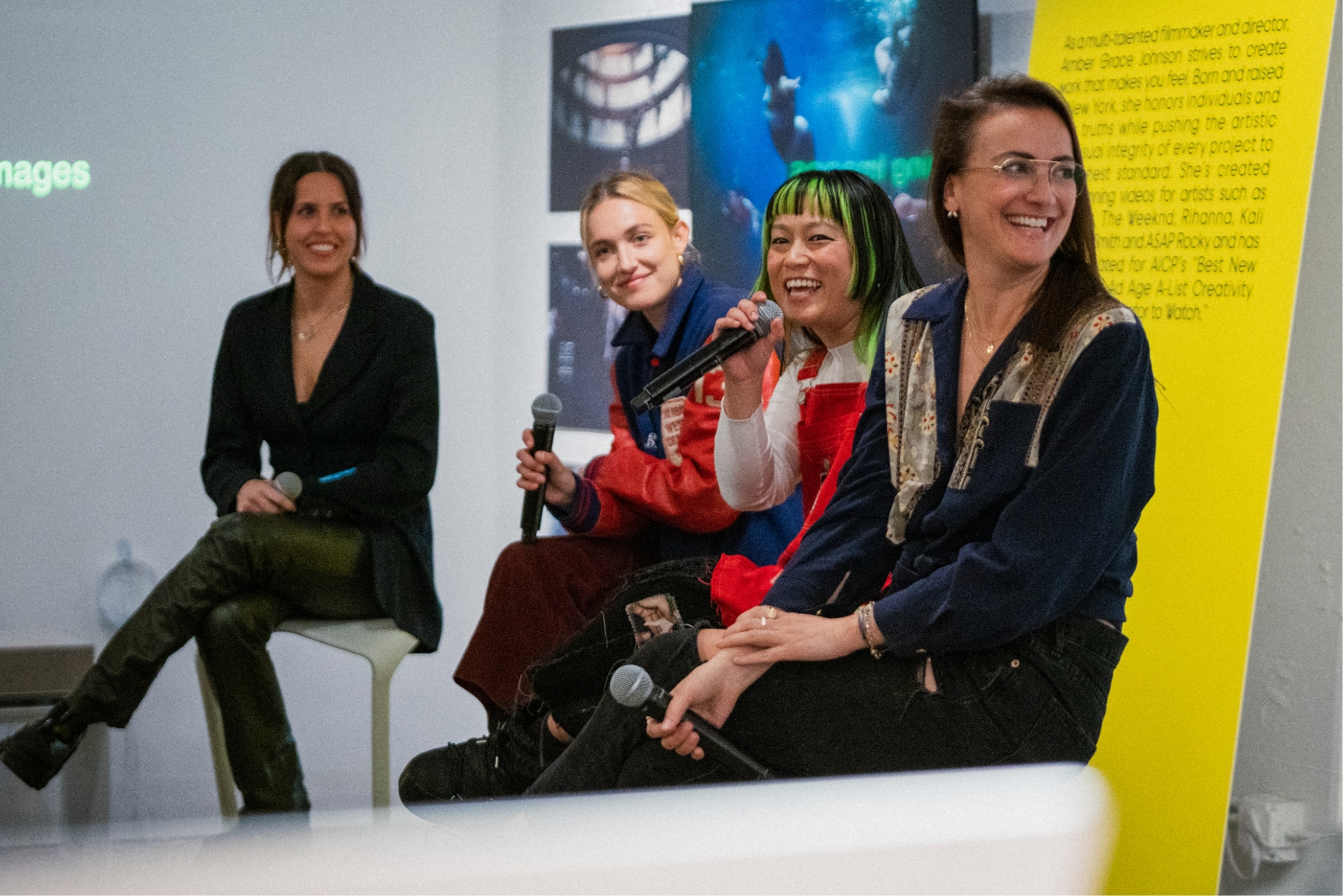 Christine, Carlotta, Amber and Natalie sitting on on stools smiling