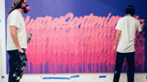 madsteez and its a living spraypainting together wearing masks