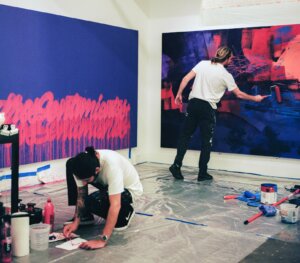 Madsteez and Its a Living paint large canvases on corner walls