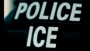 A dark background features two bold white words, "POLICE" and "ICE," stacked on top of each other, possibly indicating law enforcement or immigration enforcement.