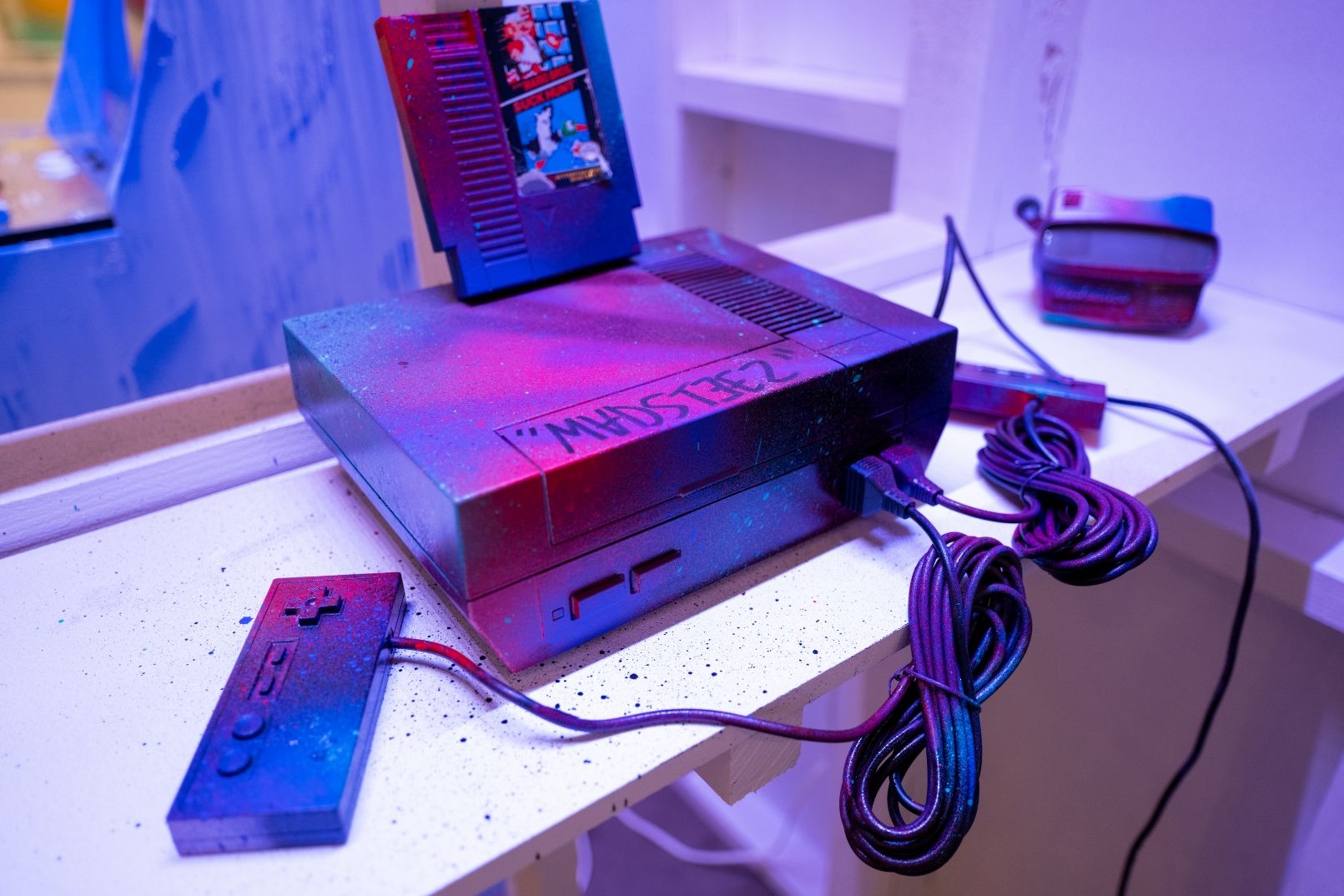 Spray painted Nintendo Entertainment System with Super Mario Bros / Duck Hunt Game