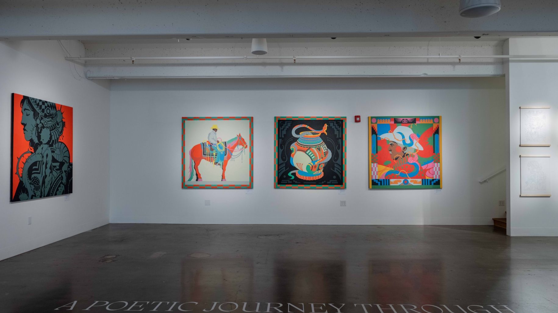 An art gallery wall displaying four colorful paintings, each with unique subjects and designs. The room has a polished concrete floor and overhead lighting.