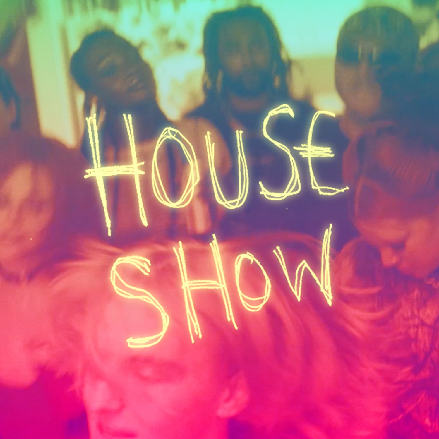 Image with the words "House Show" written over a blurred scene of people with colorful lighting.