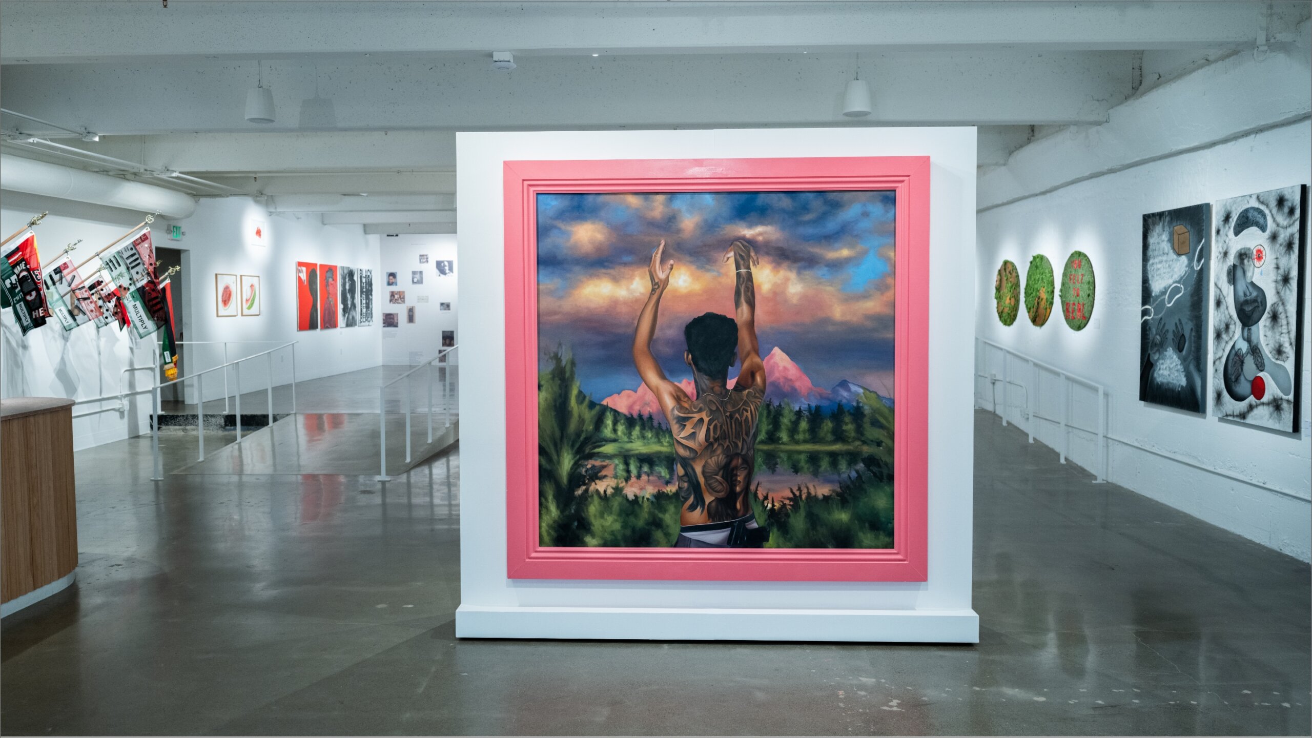 An art gallery with a painting on the wall.