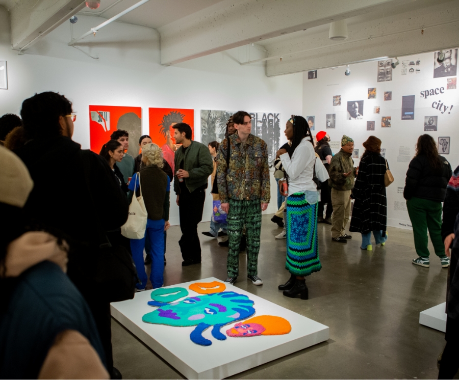 large group of people in art gallery space during opening event